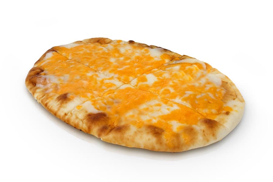 A cheese naan fresh off the grill, blistered at the edges and covered in melted cheese.