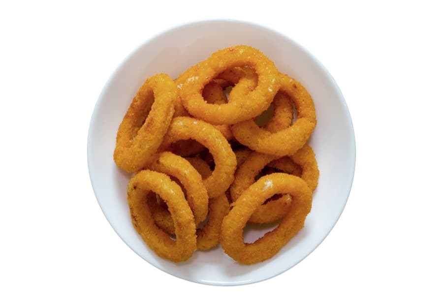 A white bowl of golden, crisp-battered onion rings.